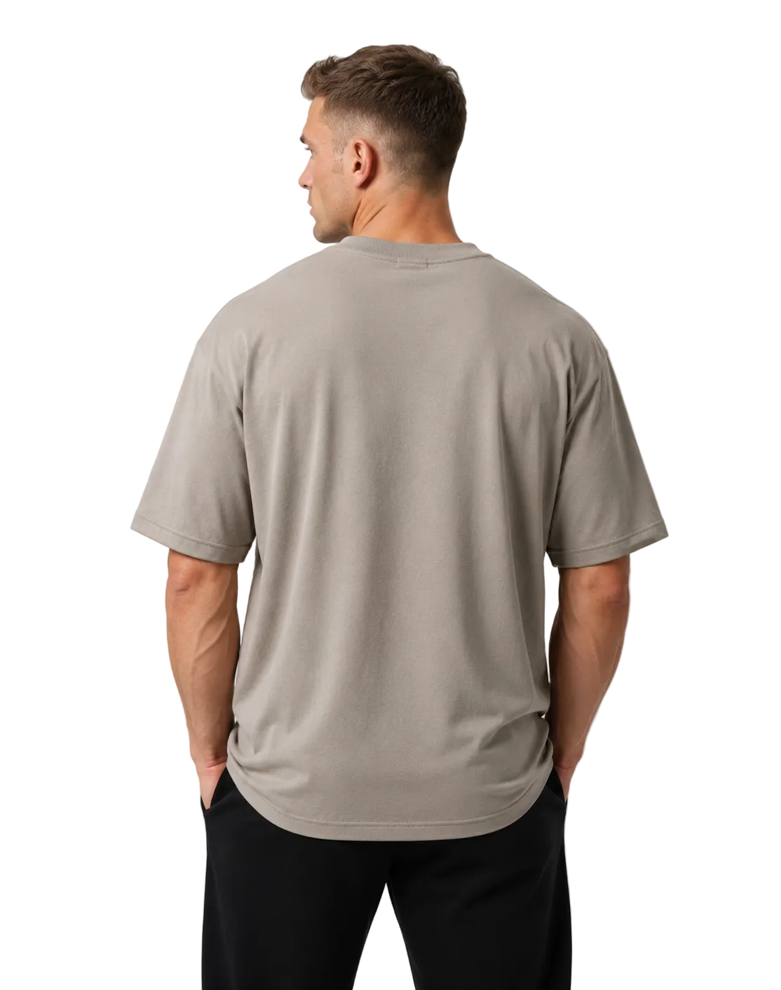 Man wearing a beige t-shirt and black pants on a light gray background
