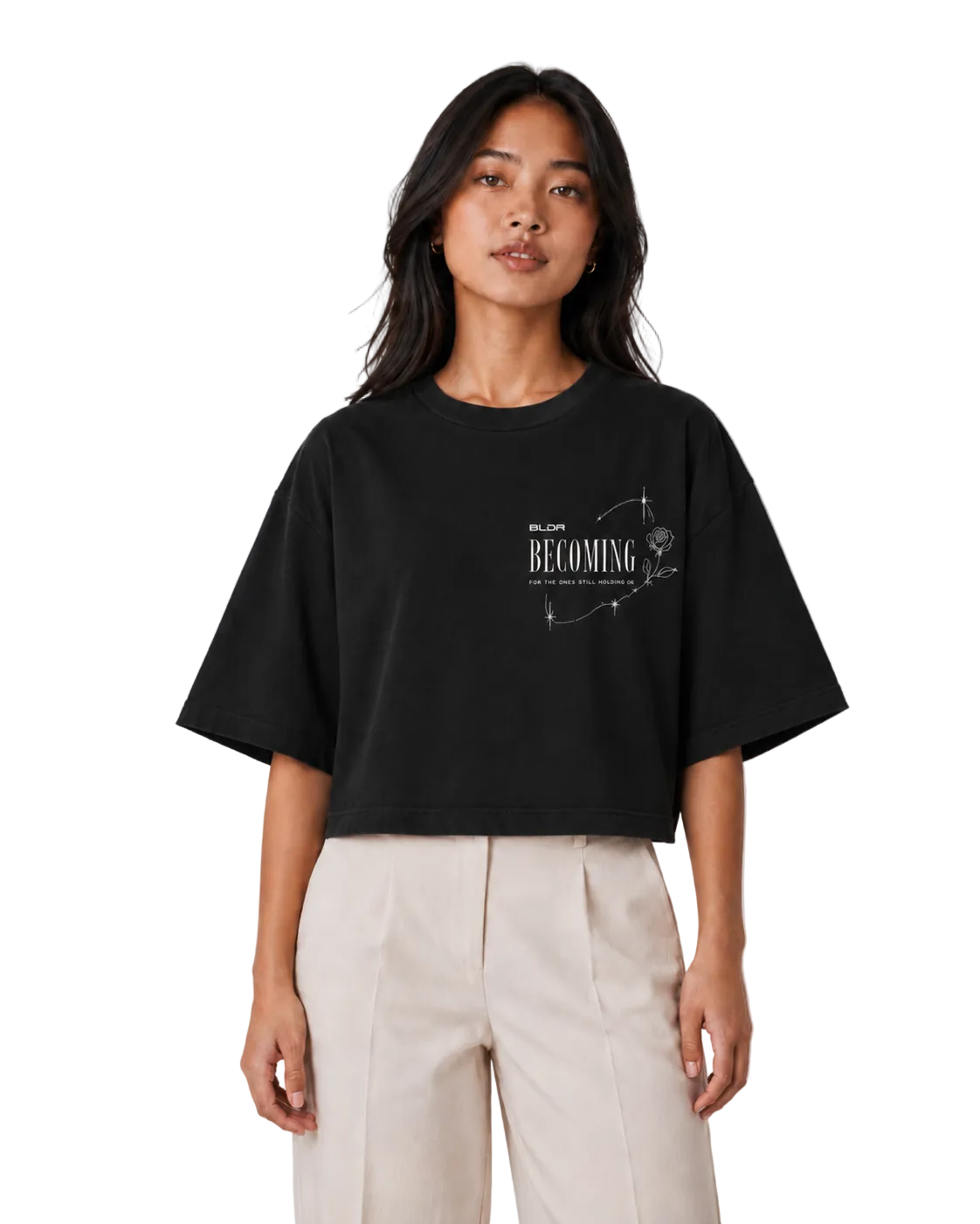 Person wearing a black t-shirt with text and graphics on a plain background