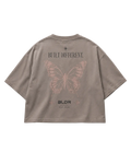 Brown t-shirt with butterfly design and text on a gray background